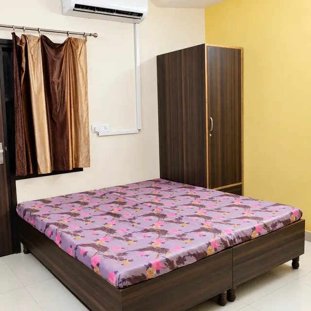 Bedroom with wardrobe and split air conditioning